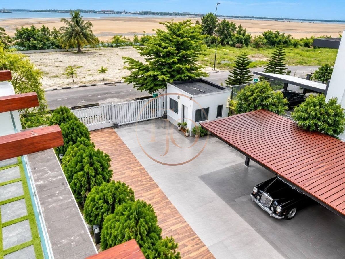Aerial view of carport, gatehouse and lagoon view from the Pinnock Beach Estate mansion